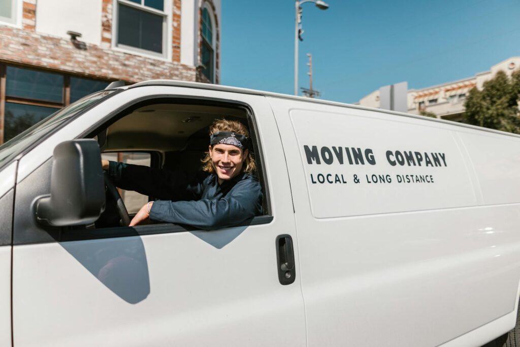 Close-Up Shot of a Man Riding a Car Smiling