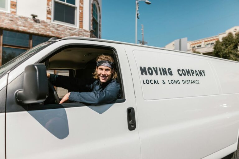 Close-Up Shot of a Man Riding a Car Smiling